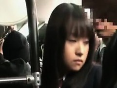 Cute Japanese girl is followed in a crowd and gets her butt